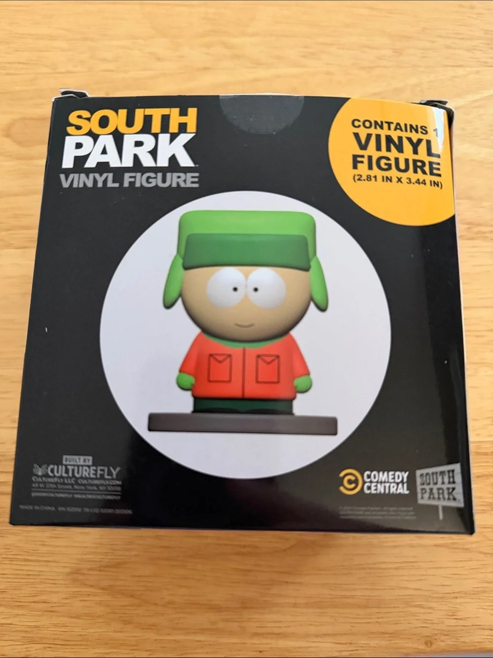 Kyle Vinyl Figure - Green Hat & Orange Jacket